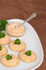 crackers salmon pate and parsley on plate