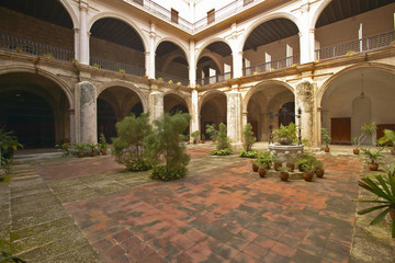 Centuries-old arches and courtyard of Hotel Florida, a colonial building in Havana, Cuba
