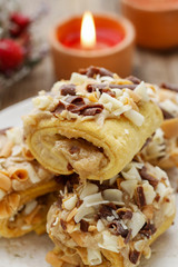 Christmas toffee buns, candles in the background