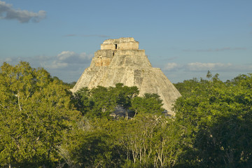 Fototapeta na wymiar Pyramid of the Magician, Mayan ruin and Pyramid of Uxmal in the Yucatan Peninsula, Mexico at sunset