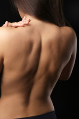 View on woman's nude back, close-up