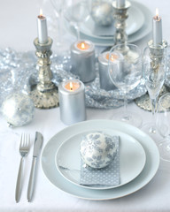 Christmas table setting in silver and white