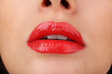 View on woman's red lips, close-up
