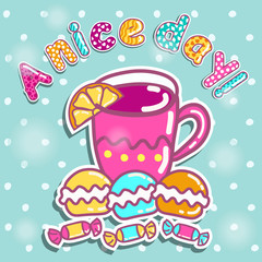 Sample cards with a cup of tea and sweets