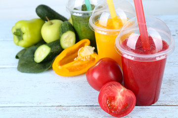 Fresh juice mix fruit, healthy drinks on color wooden background