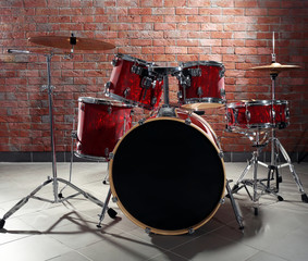 Obraz na płótnie Canvas Drum set on brick wall background