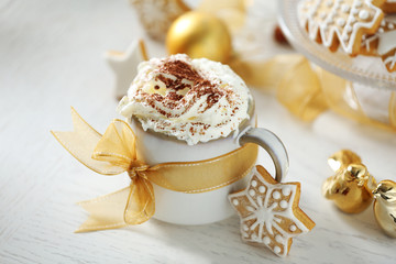 Beautiful composition with cup of cappuccino and Christmas cookies
