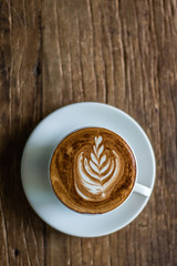 Latte Art on Wooden Background