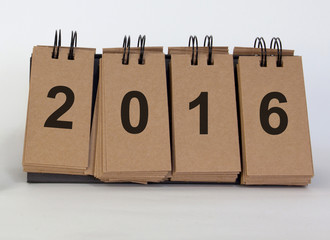 desk standing paper on white background with text new year 2016