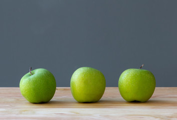 fresh three apples fruit on table