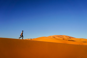 Lonely boy in desert