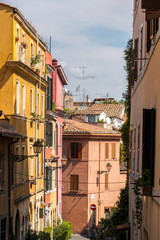 Fototapeta na wymiar Cozy street in Trastevere district of Rome, Italy