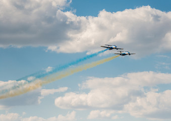 airplanes in the sky with colorful smoke of ukrainian flag 