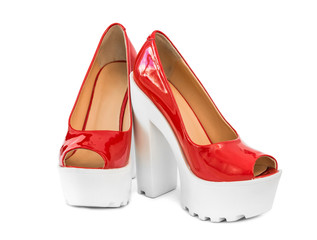 modern red patent leather shoes on white heels
