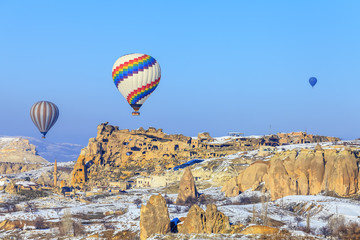 Fototapeta premium Flying balloons over mountains at sunset. Capadocia. Turkey.