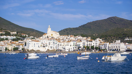 Cadaques, Costa brava, Spain: cathedral and Old Town with sailing boats.