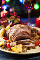 Fototapeta na wymiar Juicy roast pork on the holiday table