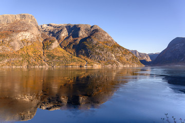 Fototapeta na wymiar Hardanger Fjord in the fall, the first ice