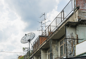 Satellite dish and attenna on a old building