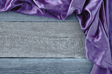 The purple cloth on a wooden board