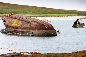 World War II boat intentionally sunk to protect the natural harbour of Scapa Flow, South Ronaldsay, Orkney, Scotland, UK - 94865749