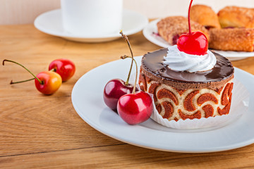 berries and cakes on rustic table