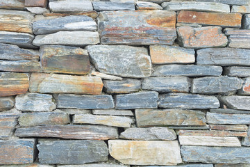 Rough raw stone bricks ancient wall