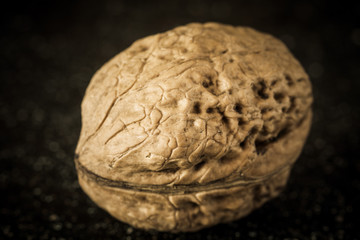 Walnuts on a black marble desk.