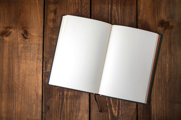 Blank notebook on wooden table