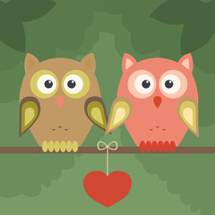 Pair of owls on tree and heart