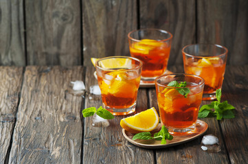 Glass of aperol with ice, orange and mint
