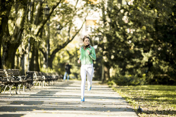 Fototapeta na wymiar Young woman running