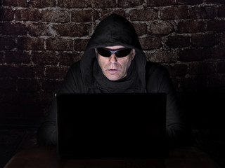 Hacker, trying to breach the security of a computer system