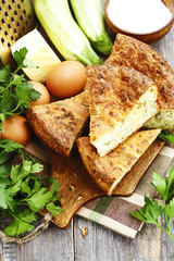 Zucchini pie with cheese and herbs