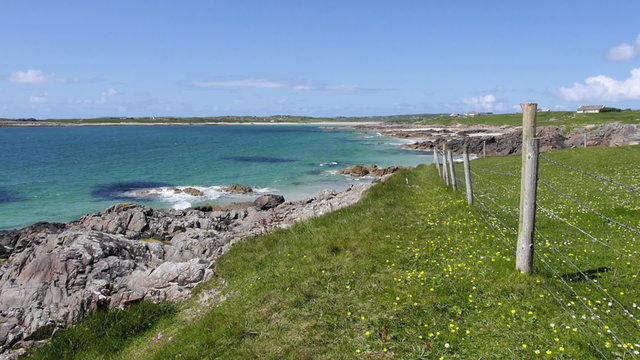 Scenic view of the Atlantic Ocean from the shore at Clifden Bay, Ireland, on a beautiful sunny day. HD 1080p slow zoom in.