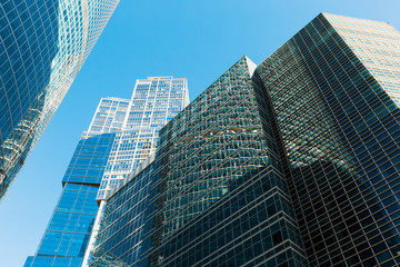 Fototapeta na wymiar Blue skyscraper facade. office buildings. modern glass silhouett