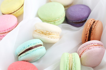 Fototapeta na wymiar French colorful and tasty macarons, close up