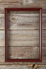 Wooden frame on grey wooden background