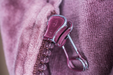 Macro Of The Rear Of A Purple Used Zipper