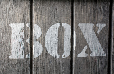 Front Macro Of Wood Panels With A BOX Logo