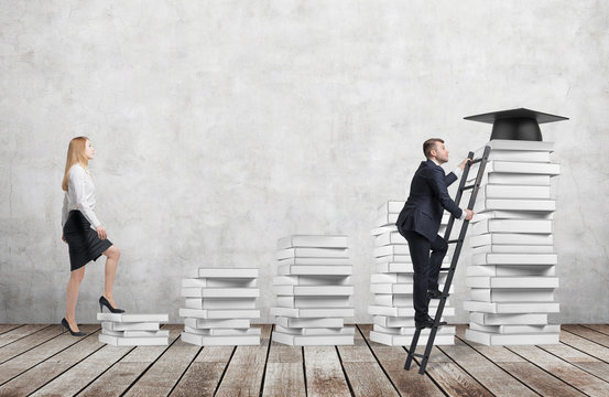 A Woman Is Going Up Using A Stairs Which Are Made Of White Books To Reach Graduation Hat While A Man Has Found A Shortcut To Get Education. Concrete Wall And Wooden Floor.