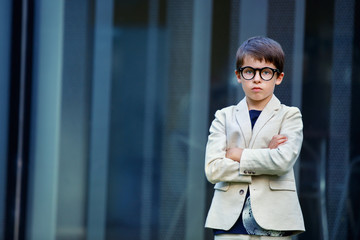 Little boy in a nice suit and glasses. Back to school