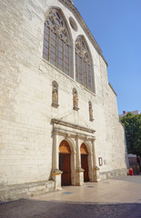 Fototapeta na wymiar The stone facade of a medieval church in Montelimar, France.