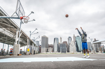 Fototapeta premium Basketball player training shots on the court
