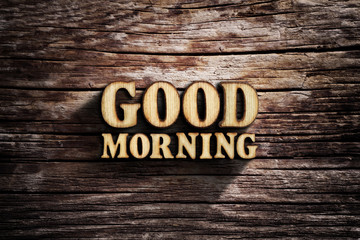 Fototapeta premium Good morning. Words on old wooden board.