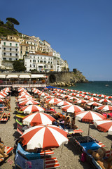 Elevated view of famous rows of beach chairs and umbrellas on Positano Beach, on Italy's Amalfi Coast