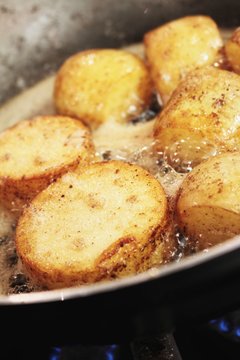 potatoes frying in pan