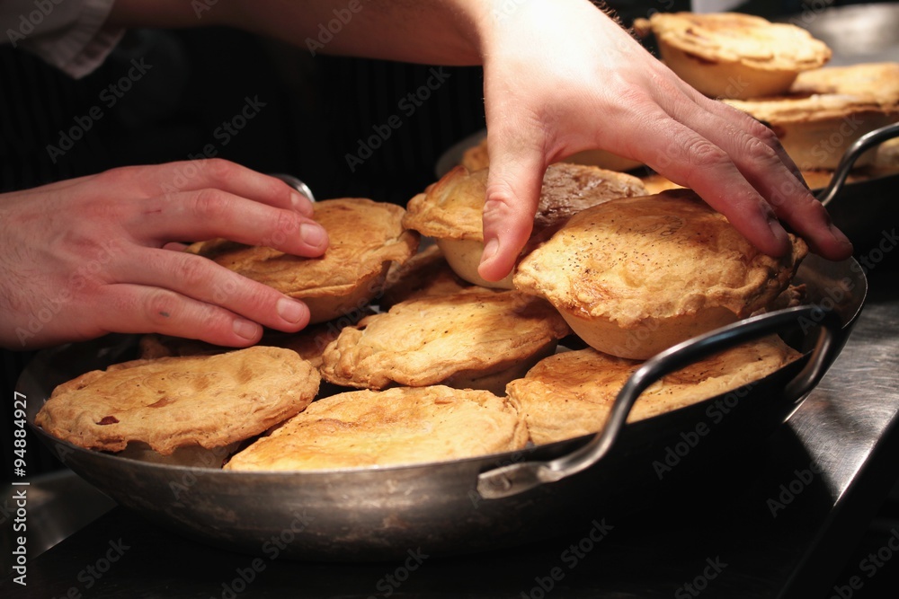 Canvas Prints chef putting pies into pans