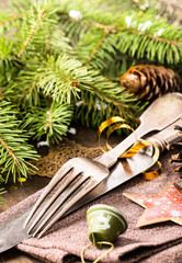 Vintage silverware and Christmas decorations around