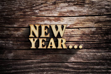 Fototapeta premium New Year... Words on old wooden board.